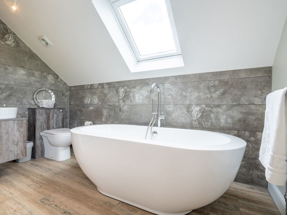 A bathroom with a bathtub and toilet at Valley View Lodge 1 Preston