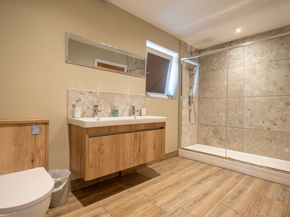 A bathroom with a shower and vanity unit at Valley View Lodge 1 Preston