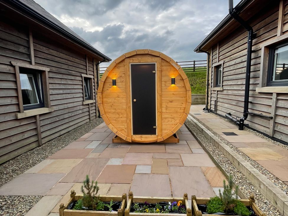 A wooden cabin structure in the outdoor area at Valley View Lodge 1 Preston