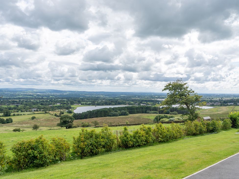 A landscape view with trees and a lake at Valley View Lodge 1 Preston