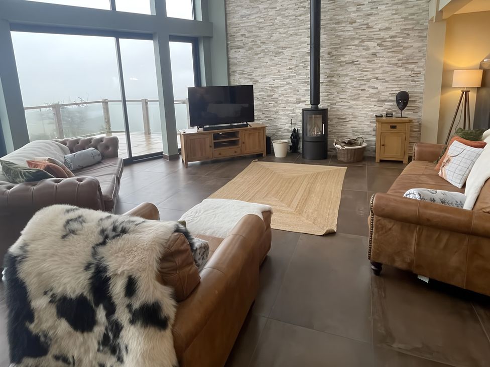 A living room with sofa and television at Pendle View Preston