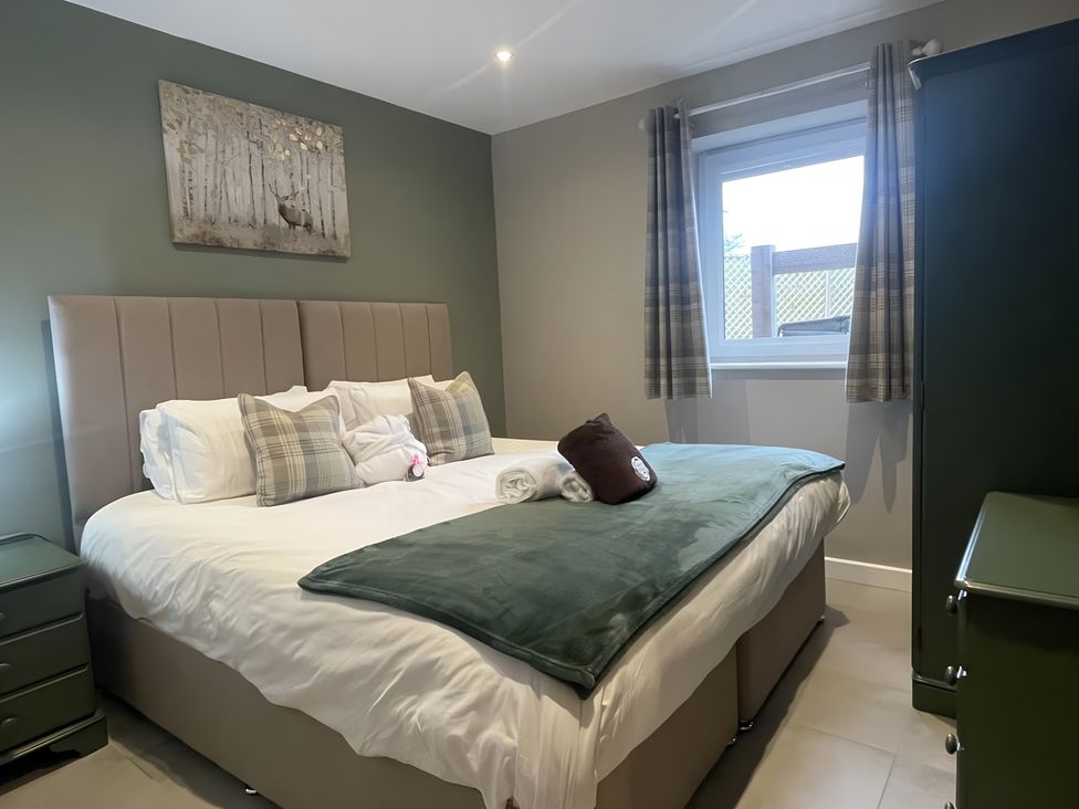 A bedroom with a bed and pillows at Pendle View in Preston