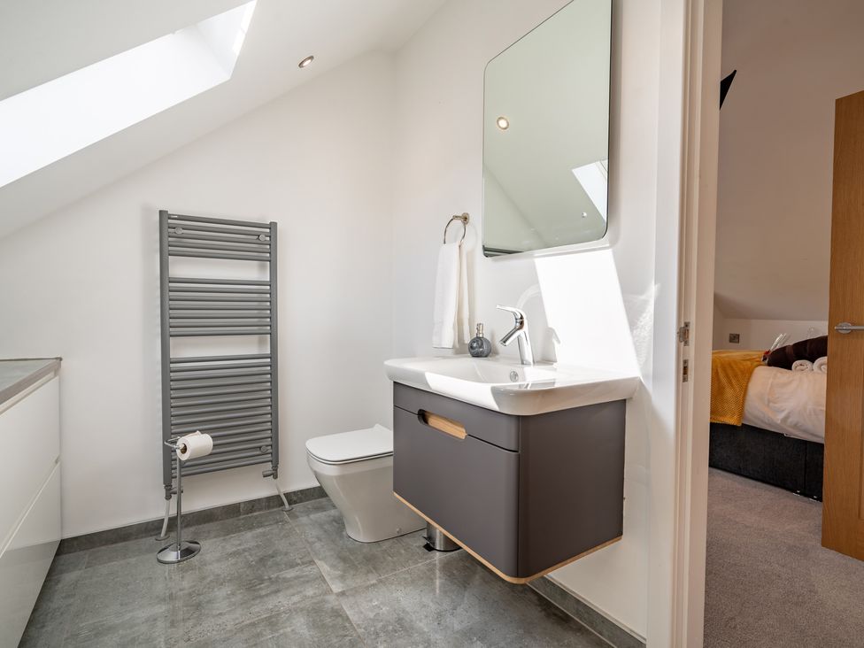 A bathroom with a sink and toilet at Pendle View in Preston