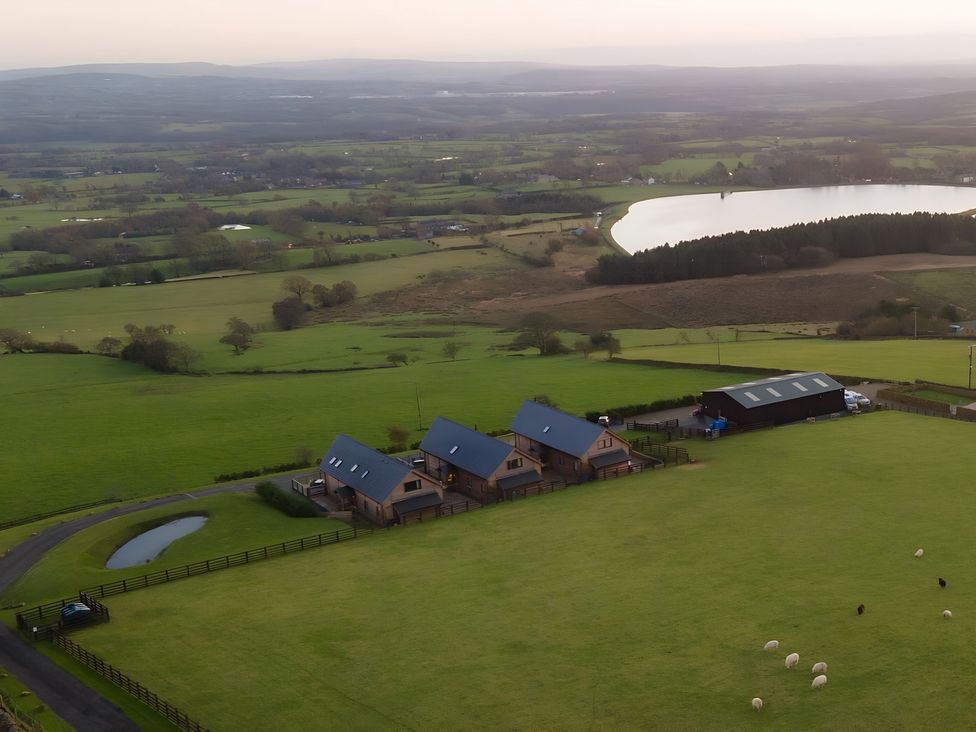 A landscape view with houses and sheep at Pendle View Preston