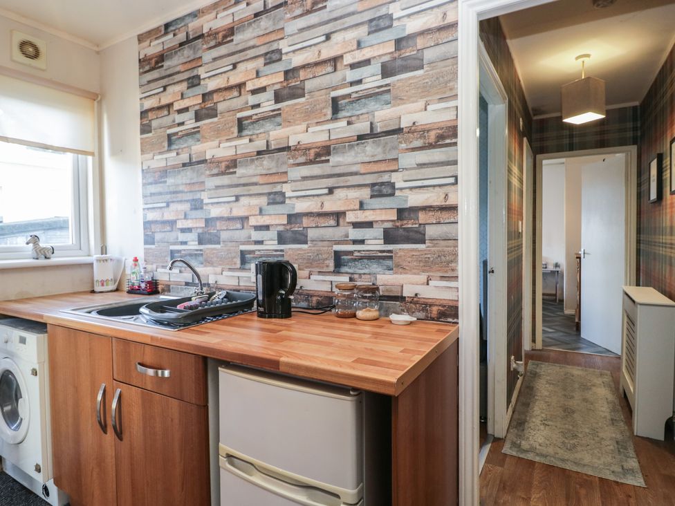 A kitchen with a sink and kettle at Beechtree Lodge 56 Denny
