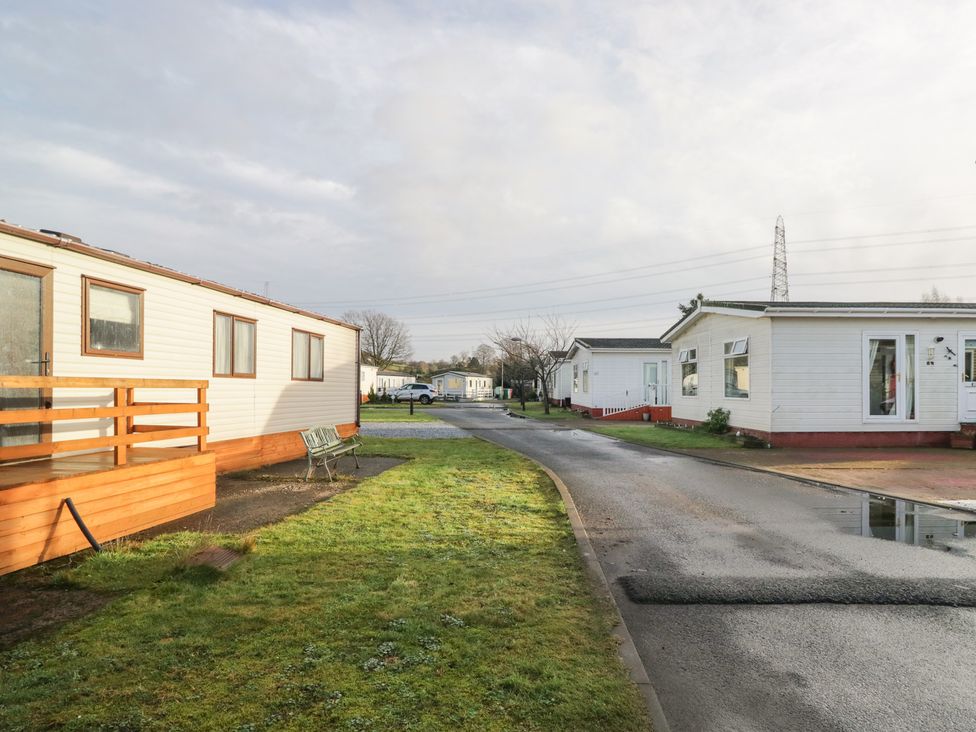 An outdoor area with mobile homes and a road at Beechtree Lodge 56 Denny