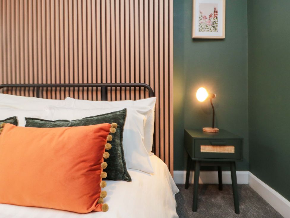 A bedroom with a bed and bedside table at Isla’s Sea Forge Saltburn-by-the-Sea