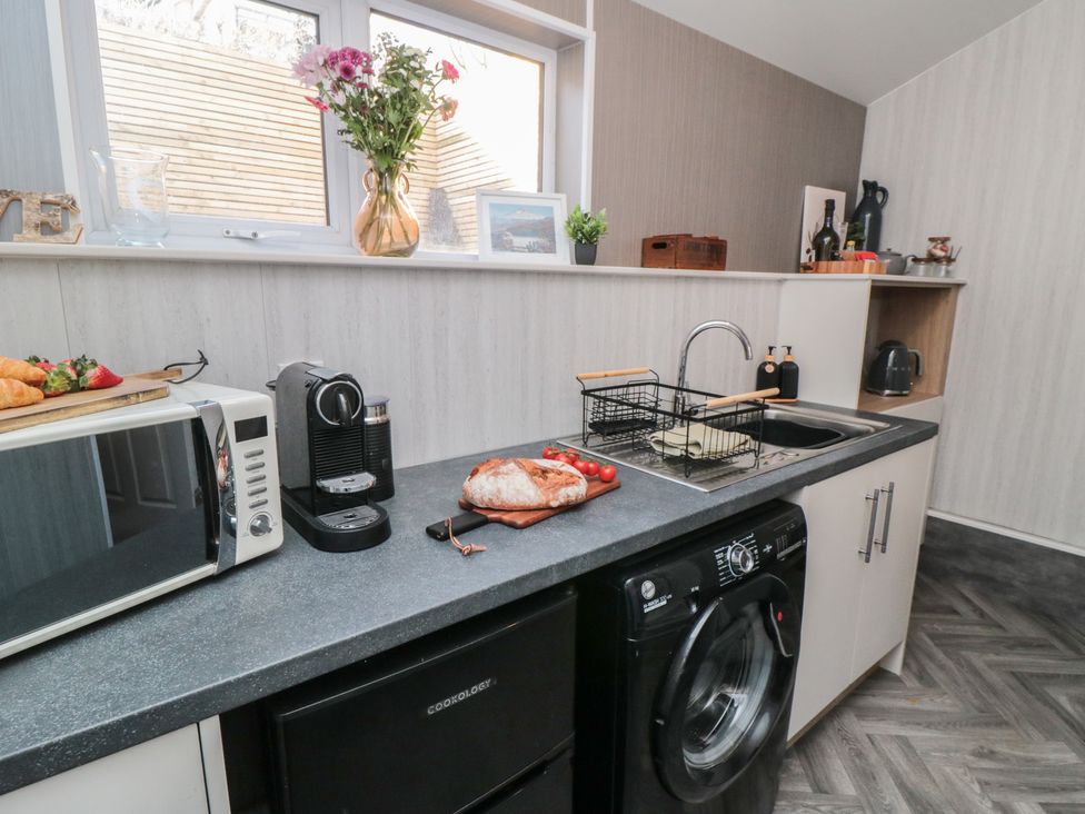 A kitchen with sink and appliances at Isla’s Sea Forge Skinningrove