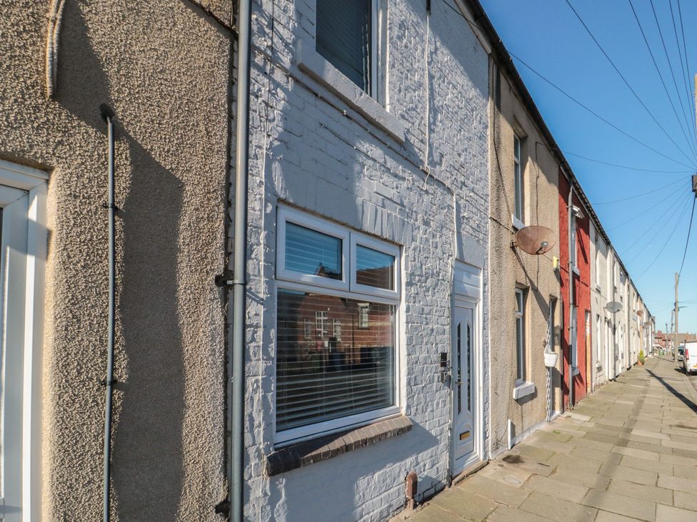 A row of houses with windows and doors at Isla’s Sea Forge in Skinningrove