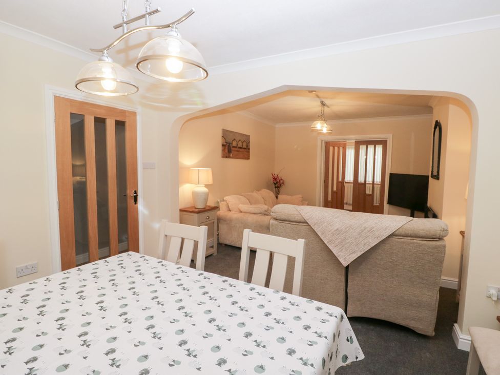 A dining room with a table and chairs at Mables in Wigton