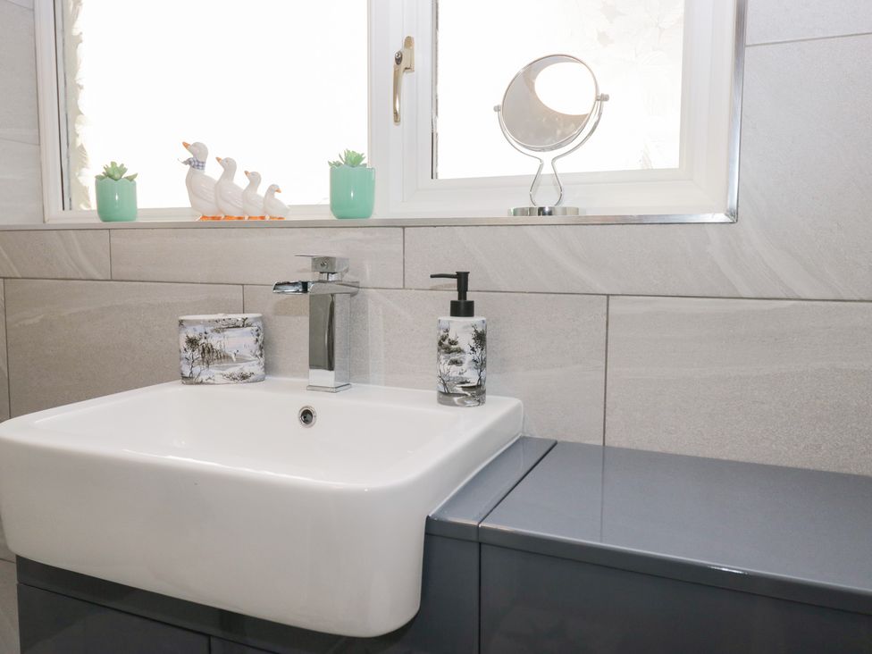 A bathroom with a sink and faucet at Mables in Wigton