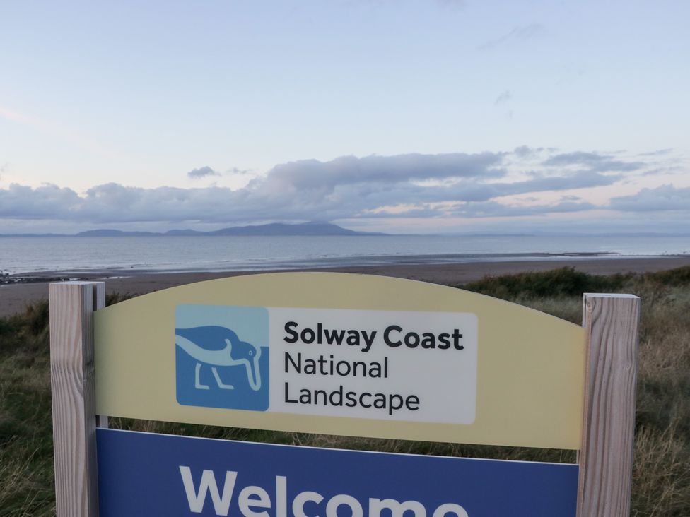 A sign indicating Solway Coast National Landscape with ocean view at Mables, Wigton