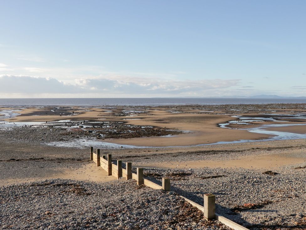 A beach with sand and water at Mables in Wigton