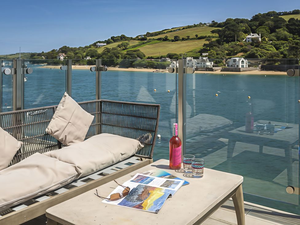 An outdoor seating area with a view of water at Villa 8, Estura in Salcombe