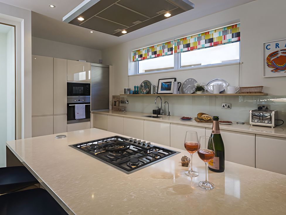 A kitchen with an island and appliances at Villa 8, Estura in Salcombe