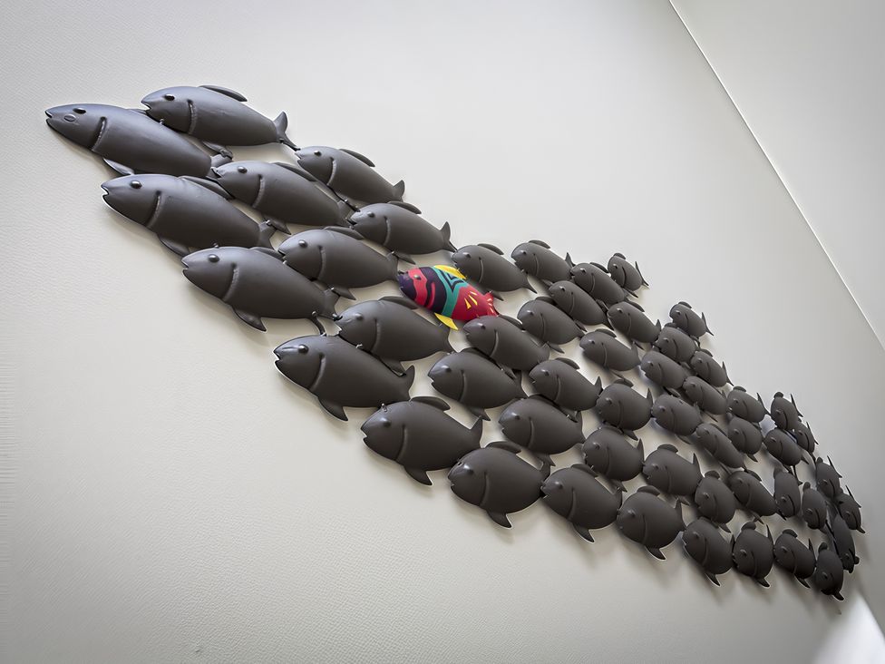 A wall with decorative fish art at Villa 8, Estura in Salcombe