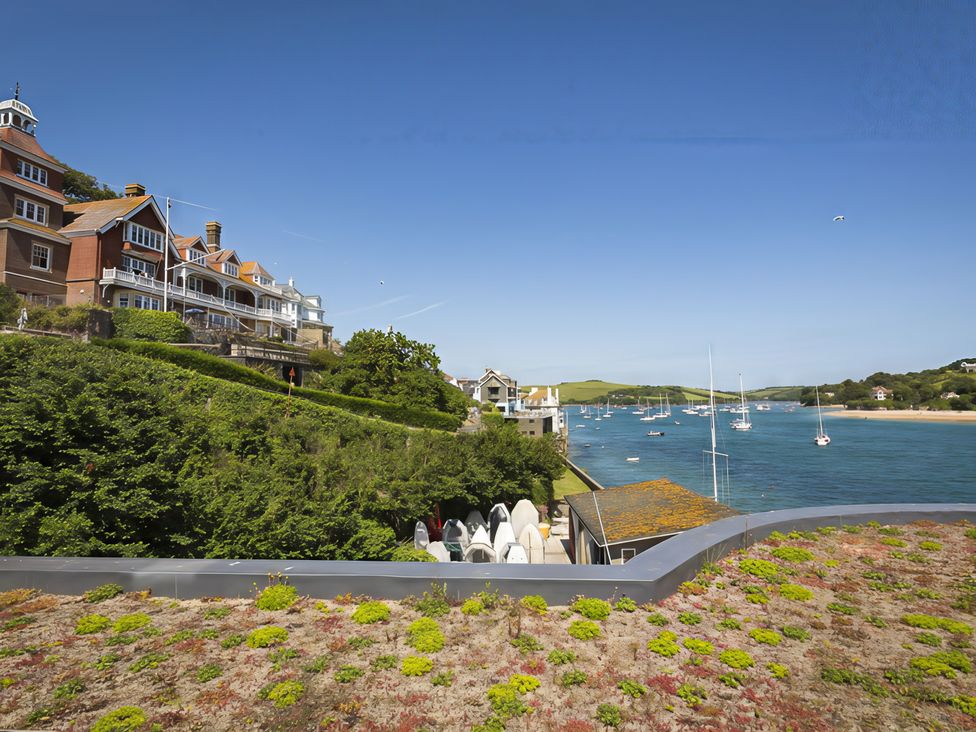 A view of houses and boats on water at Villa 8, Estura in Salcombe