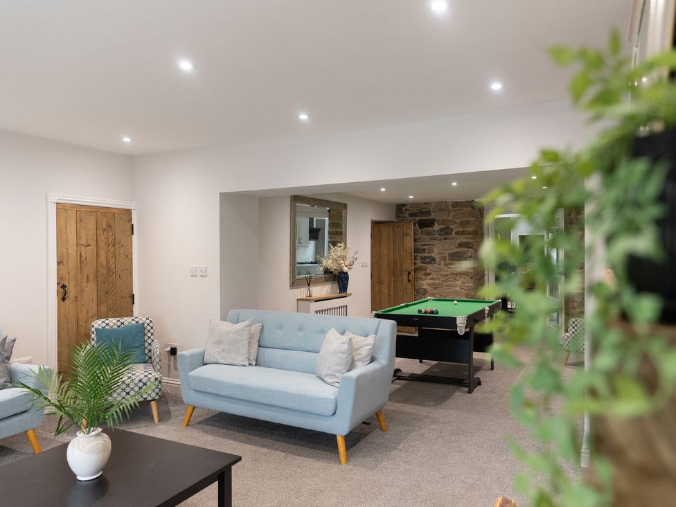 A games room with sofas and a pool table at 6 Front Street