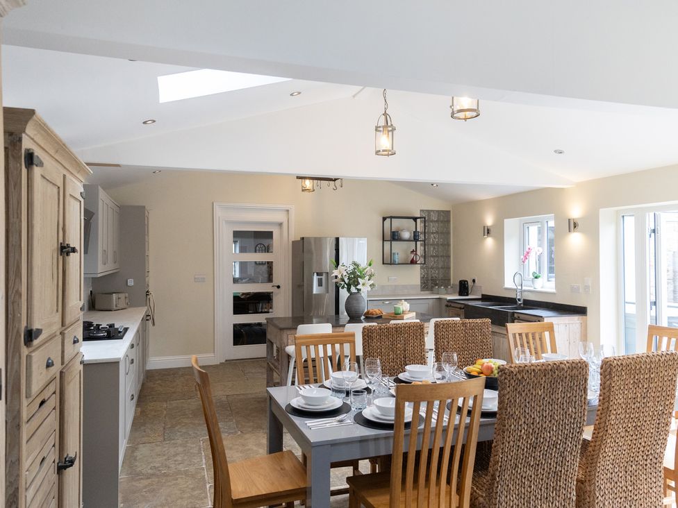 A kitchen with dining table and chairs at 6 Front Street