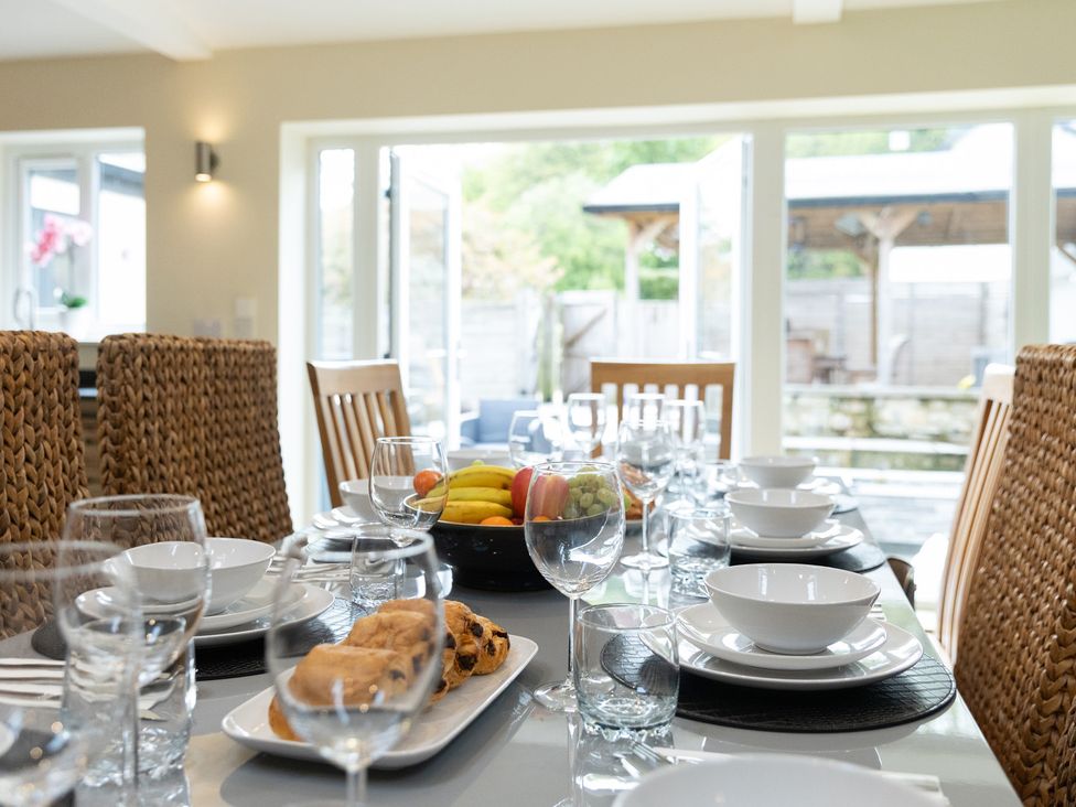 A dining table set with plates and glasses at 6 Front Street