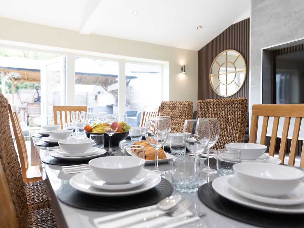 A dining room with a set table at 6 Front Street