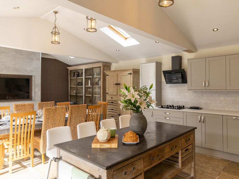 A kitchen with a table and chairs at 6 Front Street 