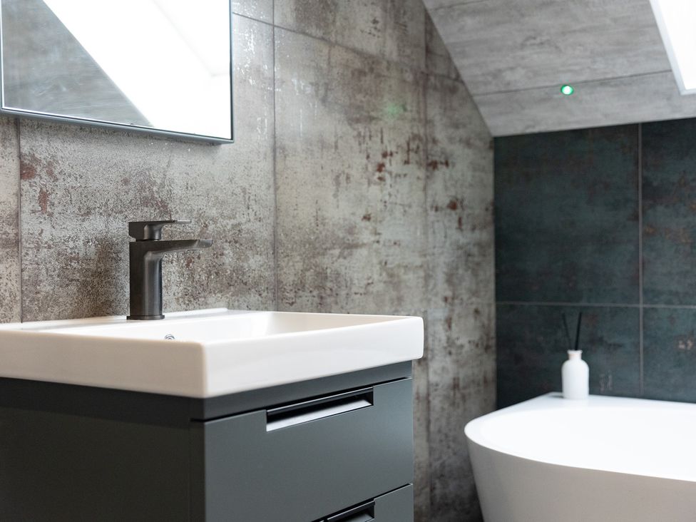 A bathroom with a sink and bathtub at 6 Front Street