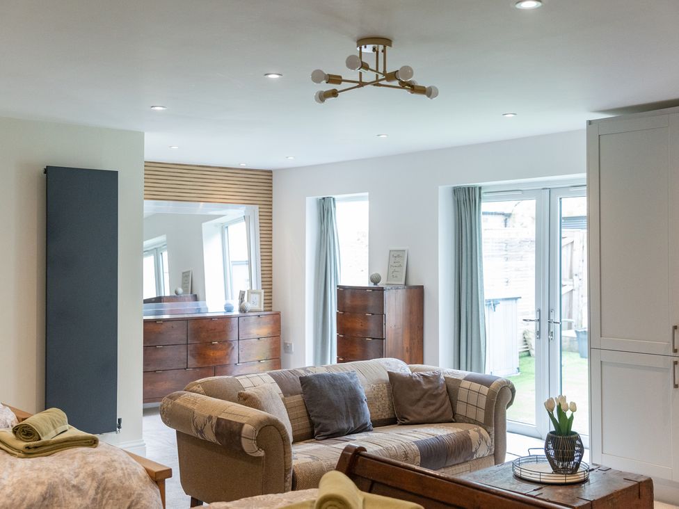 A living room with sofa and coffee table at 6 Front Street
