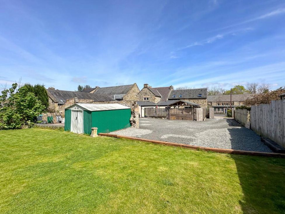An outdoor area with a shed and barn at 6 Front Street in 