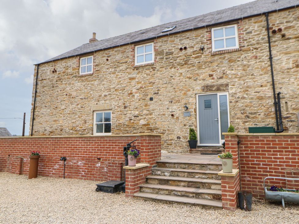 An outdoor area with steps and a stone wall at The Granary in Durham