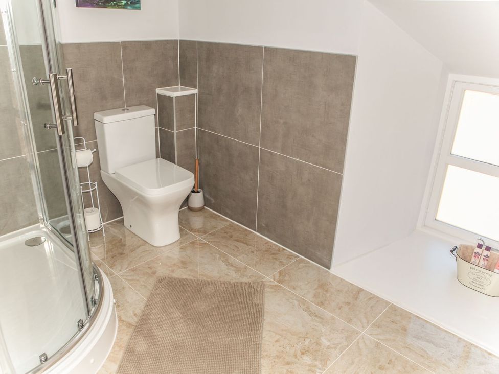 A bathroom with a shower and toilet at The Granary in Durham