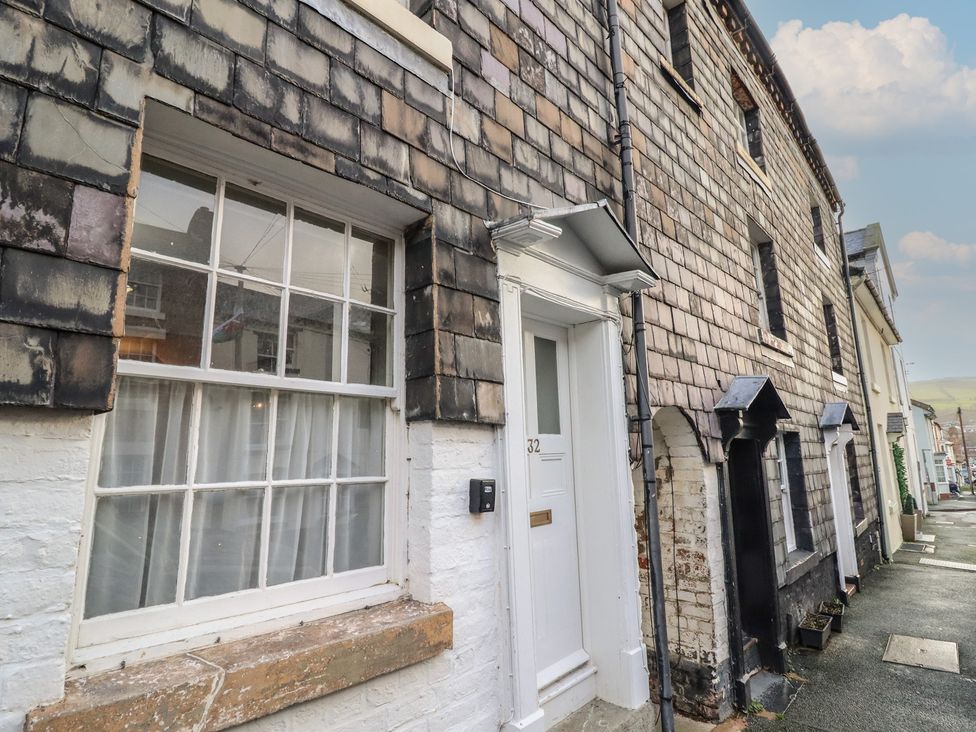 An exterior view of a house with window and door at 32 Crescent Street in Newtown