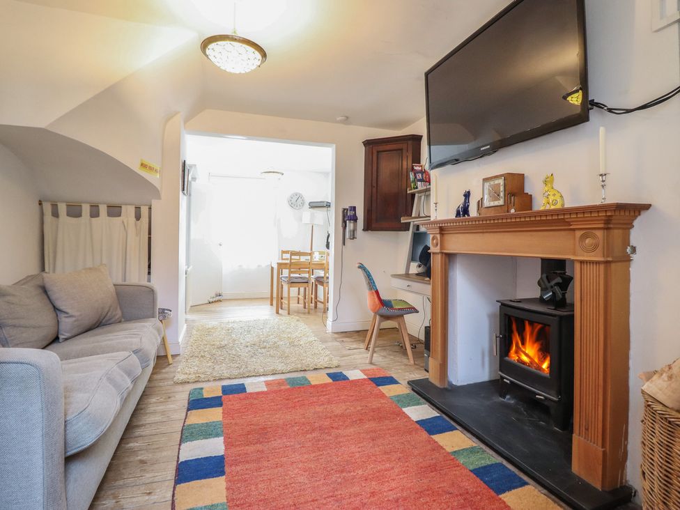 A living room with a sofa and fireplace at 32 Crescent Street in Newtown