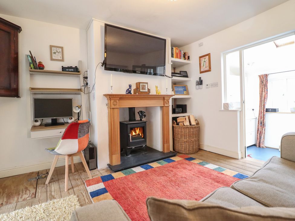 A living room with a television and fireplace at 32 Crescent Street Newtown