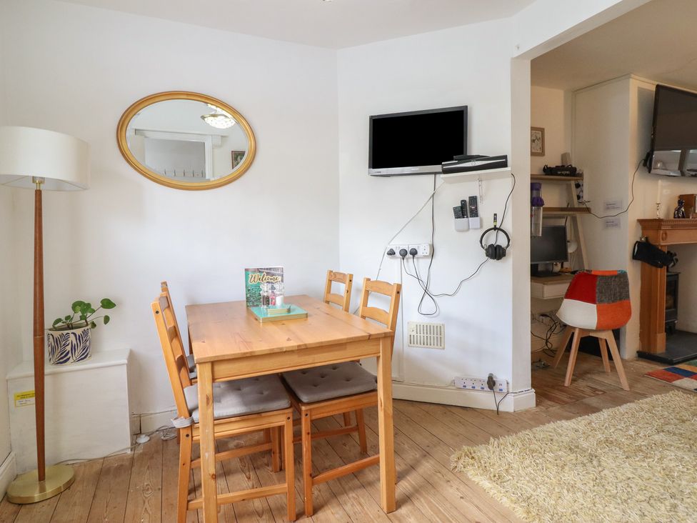 A dining room with a table and chairs at 32 Crescent Street in Newtown