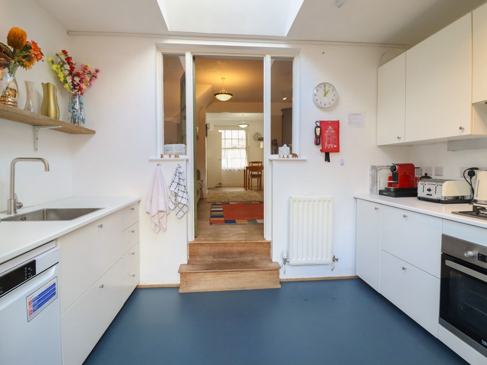 A kitchen with a sink and appliances at 32 Crescent Street in Newtown