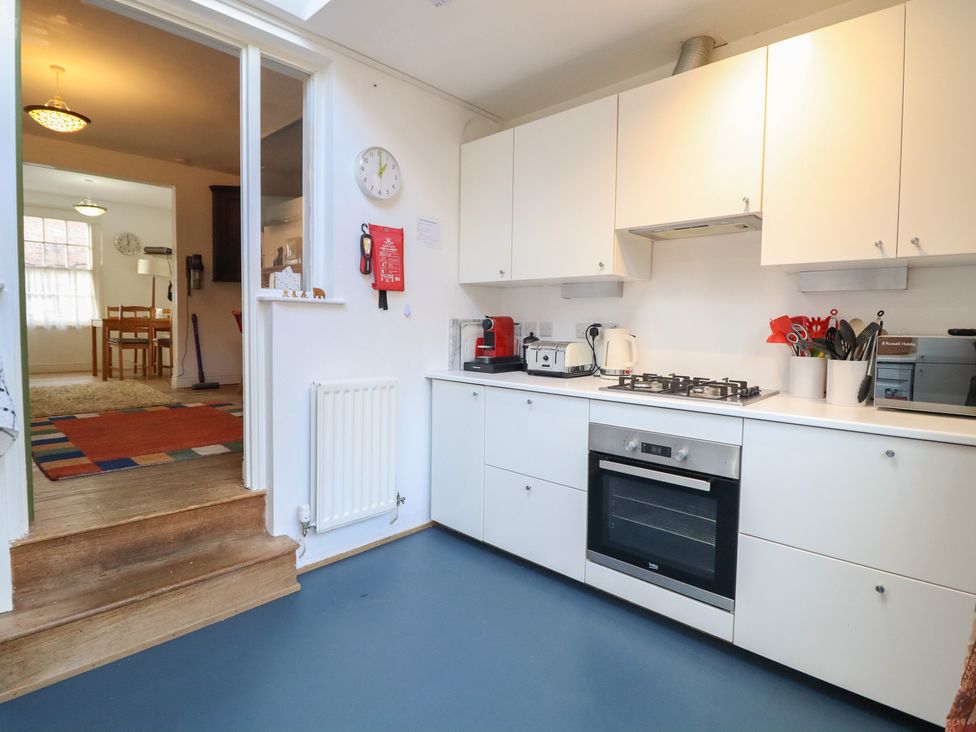A kitchen with appliances and cooking utensils at 32 Crescent Street Newtown