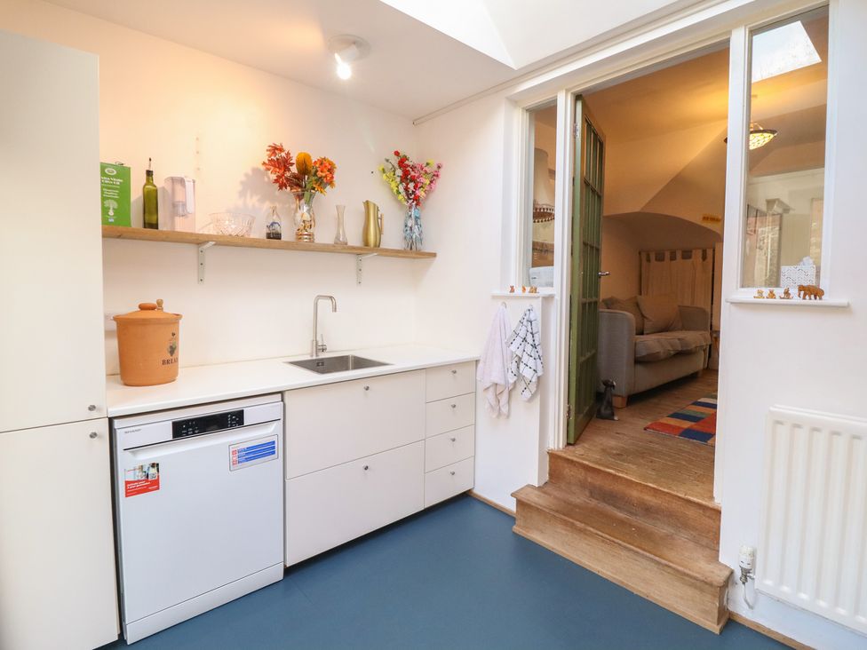 A kitchen with a sink and dishwasher at 32 Crescent Street in Newtown