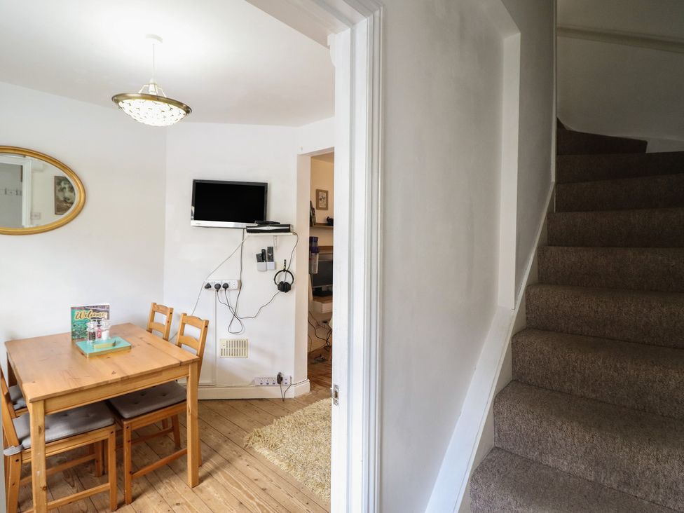 A dining room with a table and chairs at 32 Crescent Street Newtown