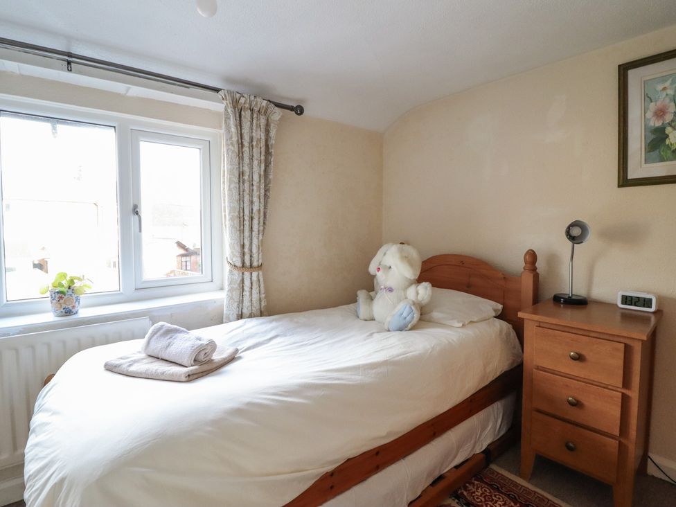 A bedroom with a bed and nightstand at 32 Crescent Street Newtown