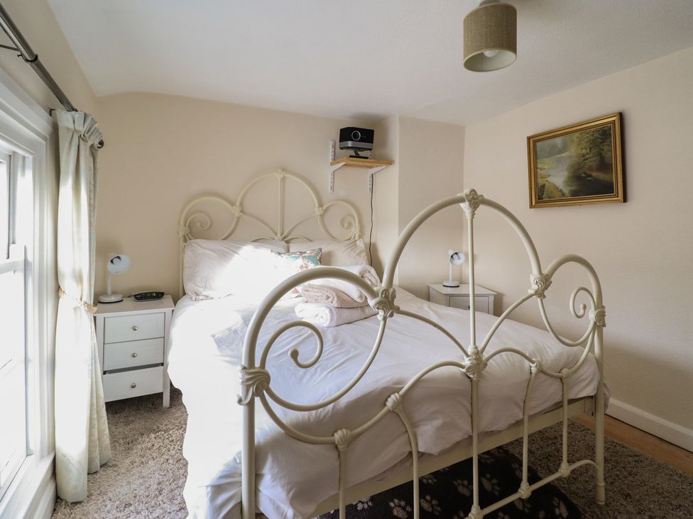 A bedroom with a bed and bedside table at 32 Crescent Street in Newtown