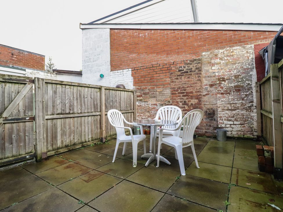 An outdoor patio with a table and chairs at 32 Crescent Street, Newtown