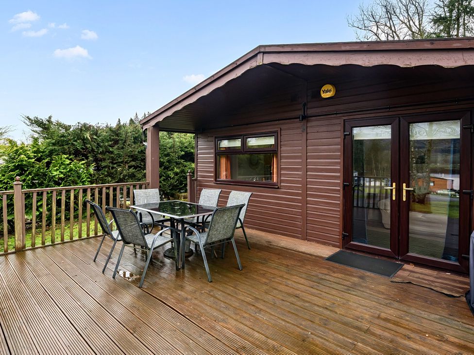 An outdoor area with a table and chairs at Cabin 1 Moffat Manor Beaufort