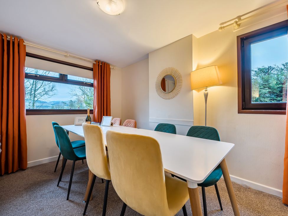 A dining room with a table and chairs at Cabin 1 Moffat Manor in Beaufort