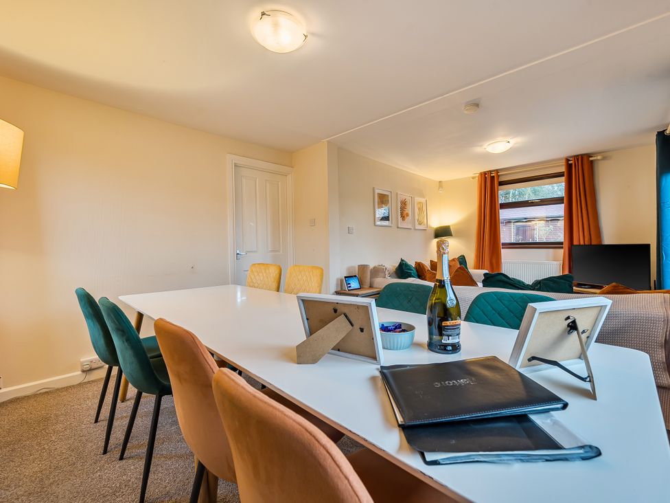 A dining room with a table and chairs at Cabin 1 Moffat Manor Beaufort