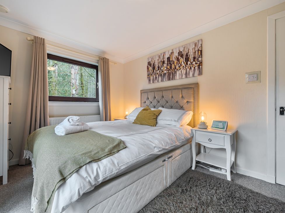 A bedroom with a bed and nightstand at Cabin 1 Moffat Manor in Beaufort