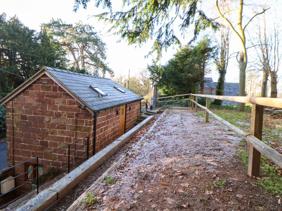 An outdoor area featuring a building and a pathway at The Apple Store in Tarporley