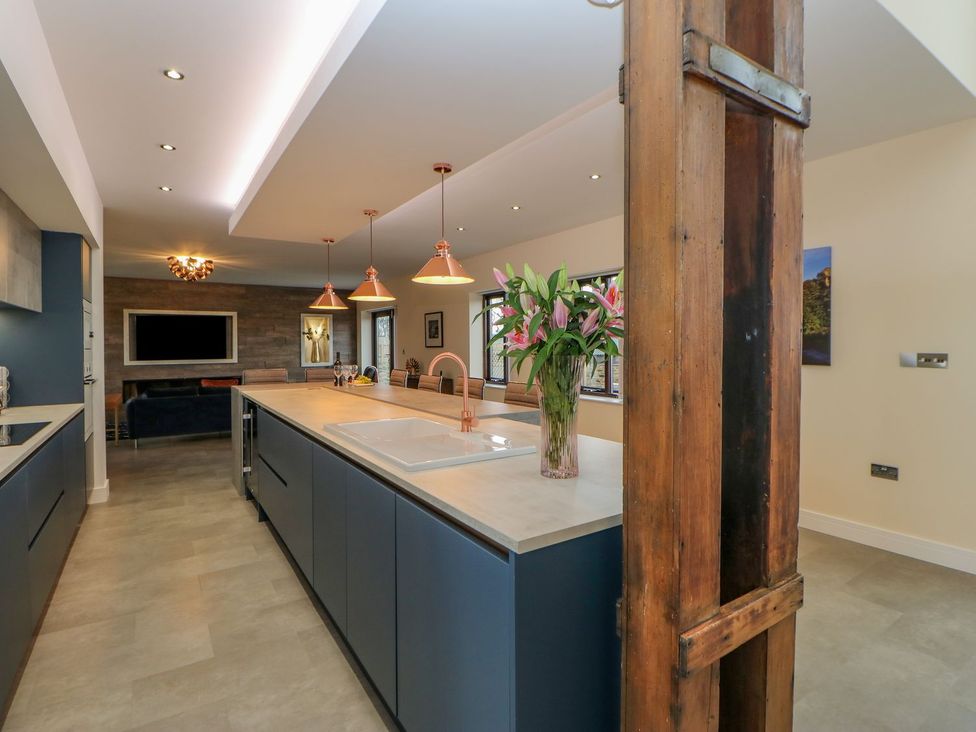 A kitchen with an island and flowers at Stackyard Durham