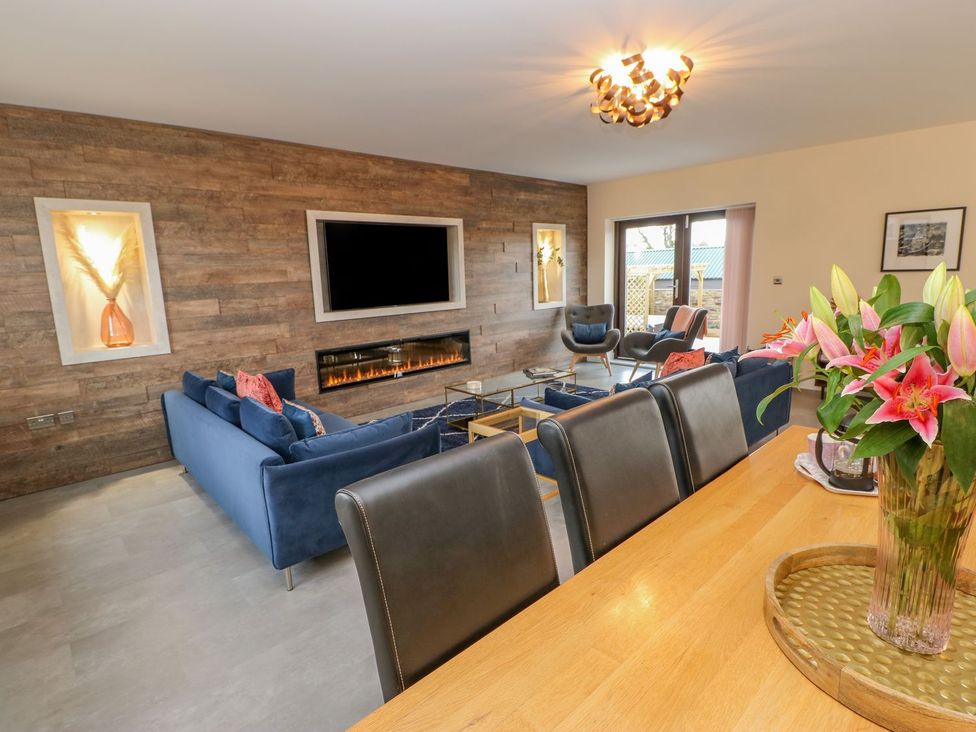 A living room with a sofa and television at Stackyard in Durham