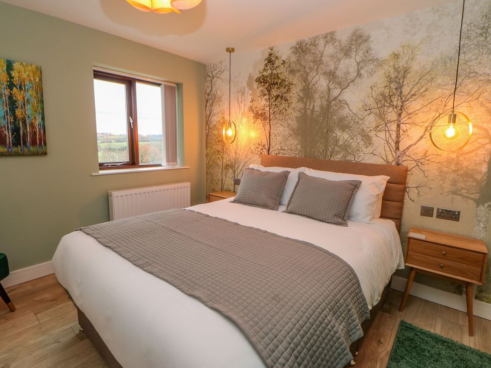 A bedroom with a bed and window at Stackyard in Durham